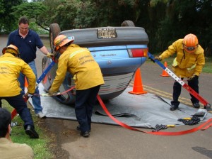 File Photo by Wendy Osher:  Maui Firefighters test tools and equipment for extracting trapped motorists during the November Fire Chief's Convention in Kapalua, Maui.