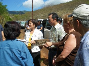 Congresswoman Mazie K. Hirono is briefed by Brian Niiya of the Japanese Cultural Center of Hawaii at the Honouliuli Internment Camp site on Oahu. August 28, 2009.  Courtesy photo.