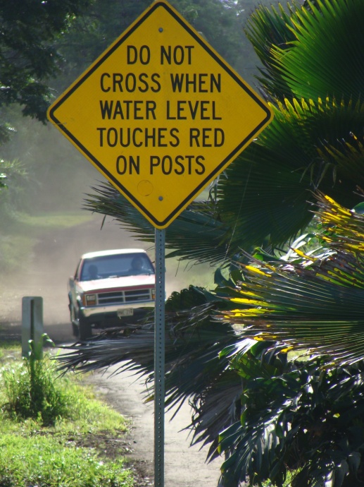 This sign is posted at the Ulaino River in East Maui, which can overflow during heavy rains, making the road impassable.  File photo by Wendy Osher.
