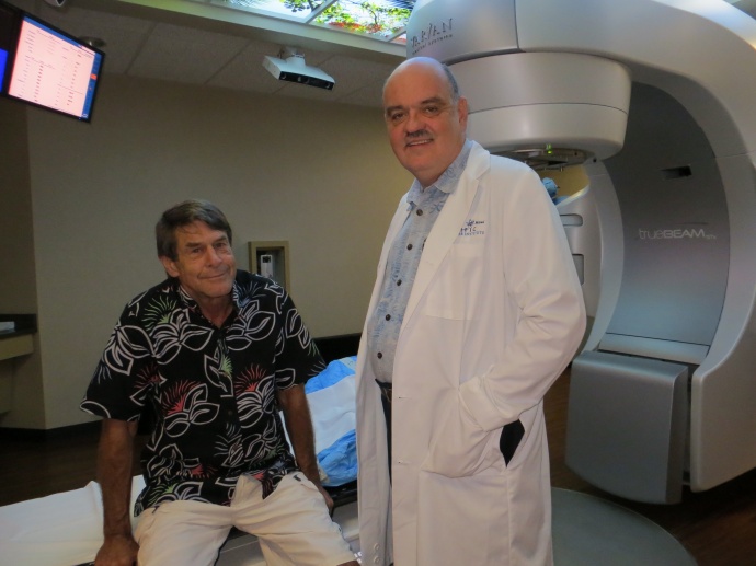 Dr. Bobby Baker, president and founder of the Pacific Cancer Instituteof Maui, talks Friday to Kihei patient Greg Benson (left) as he preparesto receive a new treatment called Stereotactic Body Radiation Therapy.Benson is one of the first three patients on Maui to receive the treatment fora moving tumor in his lung.