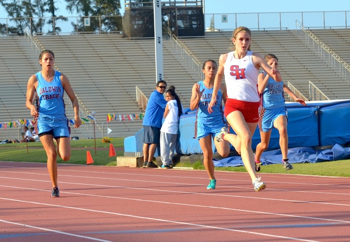 Seabury Hall's Alyssa Bettendorf races to the 100 finish en route to the girls Most Outstanding Track Athlete award for winning the 100, 200 and 400 meter dashes. Photo by Rodney S. Yap.