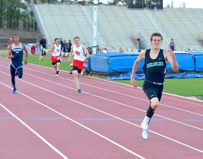 King Kekaulike's Jake Jacobs en route to a record-breaking performance in the boys 400-meter dash Saturday. Photo by Rodney S. Yap.