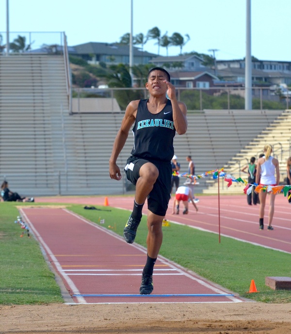 King Kekaulike's Jansen Agapay en route to his record-breaking long jump of 23 feet, 3.25 inches, at Friday's MIL Track and Field Championship Trials. Photo by Rodney S. Yap.