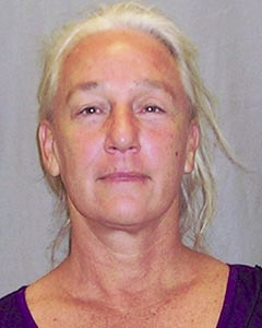 Katherine Hunter, above, is wanted in connection with a custodial interference case involving her grandson. HPD photo.
