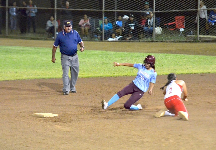 Baldwin's Alysha Sakamura gets around the tag of Lahainaluna shortstop  . Photo by Rodney S. Yap.