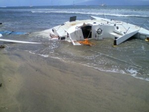 30’ sailing vessel “Caribou III” -- most of the broken pieces were quickly removed except for the mast and the mooring gear (ball and chain) which will be removed by Parker Marine when the surf subsides. The beach area is now clear.  Photo courtesy Maui District Boating Office.