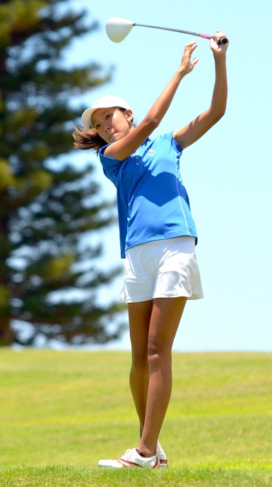 Moanalua's Eimi Koga watches her drive at No. 14. Koga finished ninth overall at 78-77—155. Photo by Rodney S. Yap.