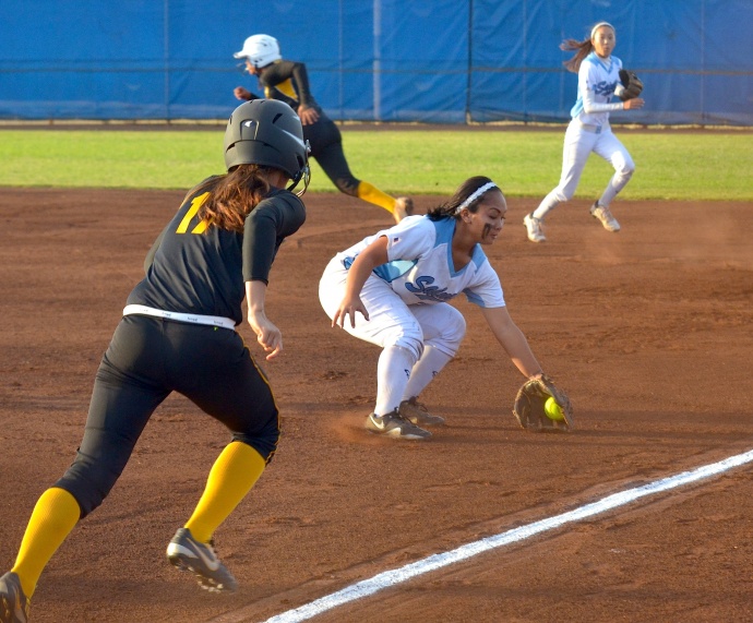 Saint Francis first baseman Rasela Vili makes a play on a ground ball hit by Brayann Meyers in the second inning of the girls Division II state softball championships at Patsy Mink Field. Photo by Rodney S. Yap.