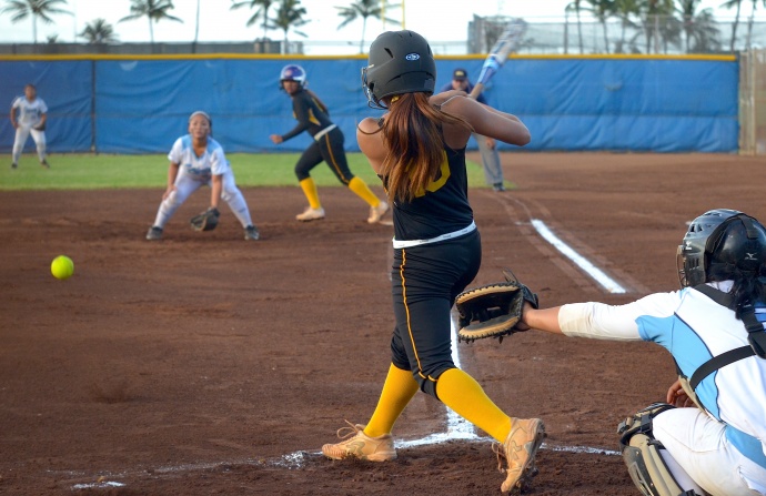 Nanakuli pitcher Chyanne Koko hits as RBI single to right field in the first inning against Saint Francis Friday at the state Division II girls softball tournament at Patsy Mink Field. Koko's hit helped the Golden Eagles grab a 1-0 lead. Photo by Rodney S. Yap.