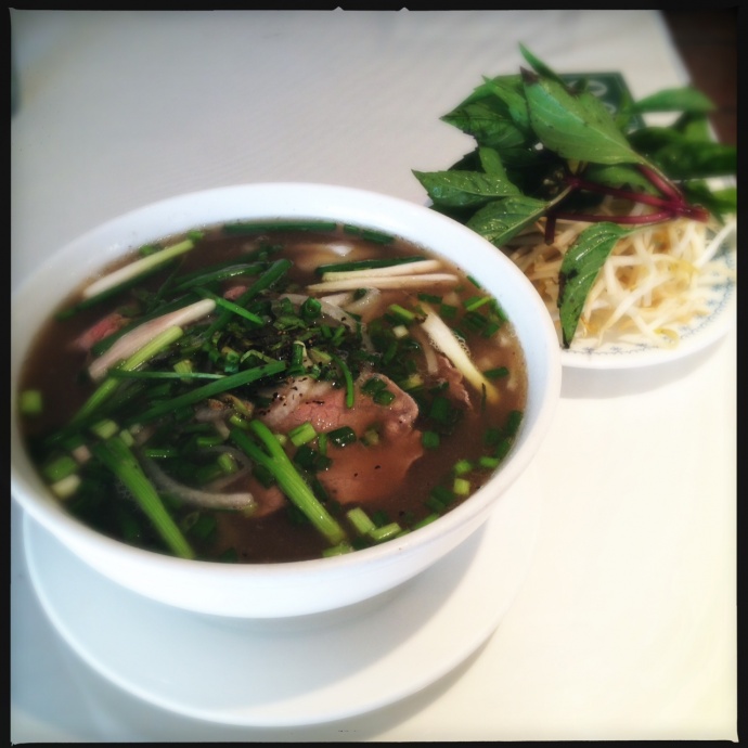 Saigon Seafood's Pho arrives with a solid pound of Thai basil. Photo by Vanessa Wolf