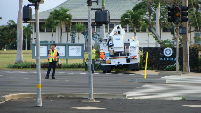 Kahului power outage. Police direct traffic while MECO crews repair lines that were downed early Friday morning, 6/7/13. Photo by Wendy Osher.