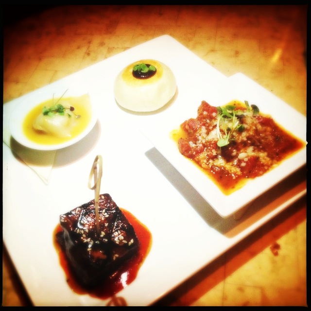The entree offers a taste of their short ribs, bao bun, seafood wonton and ahi meatballs. Photo by Vanessa Wolf