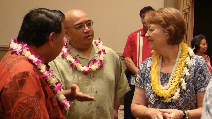 Sen. Gil Keith-Agaran (middle) awaits signing of Maui legislation alongside Maui Mayor Alan Arakawa (left) and Sen. Roz Baker (right). Photo by Wendy Osher.