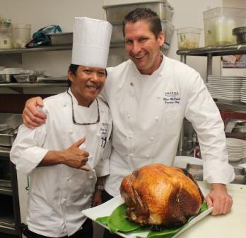 Makena Resort’s Executive Chef Marc McDowell and Executive Sous Chef Steve Avergonzado prepare their signature Sage and Thyme Brine Roasted Whole Tom Turkey.