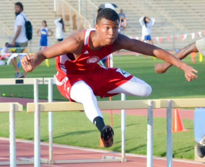 Lahainaluna's Emerson Liburd en route to winning the boys 110-meter high hurdles in 14.71 seconds Friday at War Memorial Stadium. Photo by Rodney S. Yap.