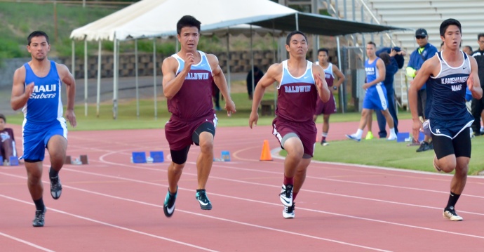 From left, Maui High's Justin Carvalho, Baldwin's Dylan Leigh,  Baldwin's Jocel Aquino and Kamehameha Maui's Nainoa Silva race in one of the varsity boys heats of the 100-meter dash. Leigh won in 11.13 seconds, followed by Silva in 11.54, Carvalho in 11.66 and Aquino was timed in 11.77. Photo by Rodney S. Yap. 