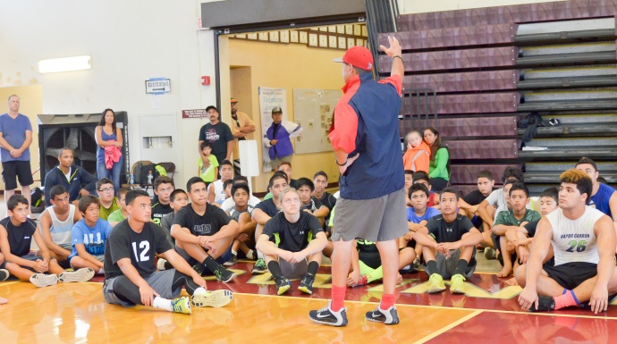 Coach Vince Passas talks to more than 70 football athletes who attended Saturday free "Get Better" Camp at Baldwin High School. Photo by Rodney S. Yap.