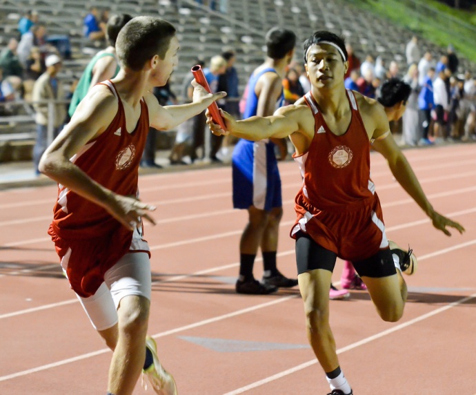 The Lahainaluna boys 4 x 400 relay team makes the first exchange in the finals of the Yamamoto Invitational. Photo by Rodney S. Yap.