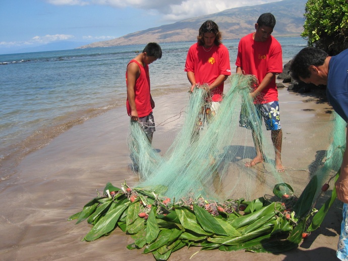 Students of a local canoe club participate in traditional method of gathering fish.  Credit: NOAA