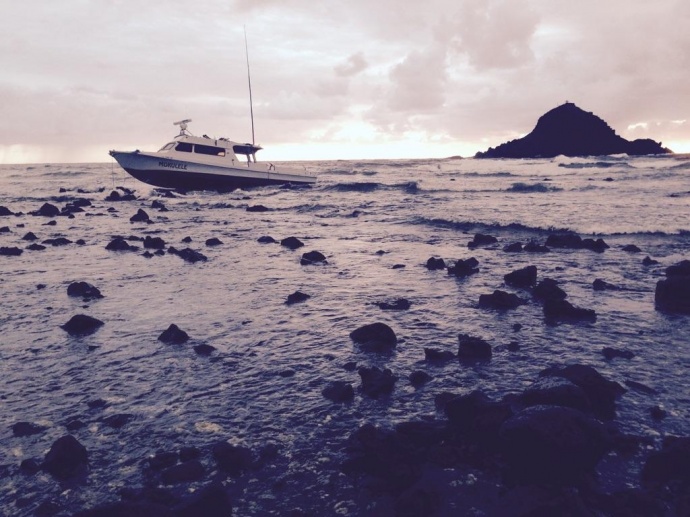 "Mokulele" vessel aground at Koki Beach in East Maui. Photo courtesy MFD, April 10, 2015.