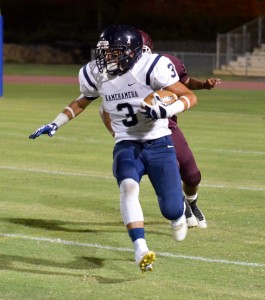 Kamehameha Maui's Ekolu Watanabe (3) looks for running room in the first quarter. Photo by Rodney S. Yap.