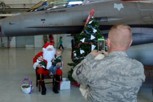 Swamp Fox Airmen and their families welcome the arrival of Santa Claus at McEntire Joint National Guard Base, S.C., Dec. 5, 2015. Follow Santa as he travels the globe by visiting www.noradsanta.org. (U.S. Air National Guard photo by Airman 1st First Class Ashleigh S. Pavelek/Released)