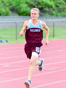 Baldwin's Tyler Cooper wins the boys 3000 in 10:30.80 Friday. Photo by Rodney S. Yap.