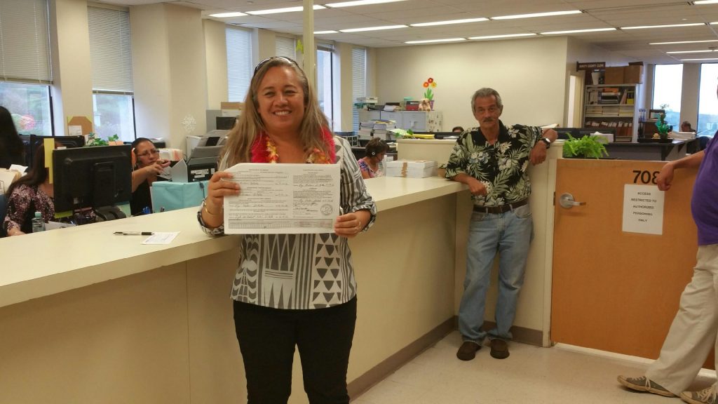 Rep. Lynn DeCoite holding her papers at the Maui County Clerks Office 