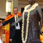 A fresh plumeria lei is one of dozens that were strung for the occasion in honor of the Queen.