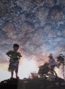 First Place: Ghialana Borges, Kahuku High School, 12th grade  Title: Reflections (Silhouette of children near water)  Medium: Photography