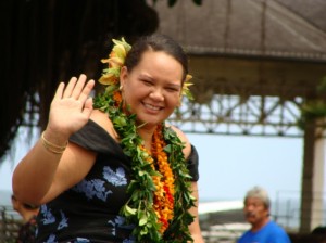 Cherissa Henoheanapuaikawaokele Kane of Halau Kealaokamaile waves spectators along the Merrie Monarch parade route after winning the title of 2009 Miss Aloha Hula in the 46th Annual event.
