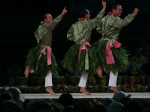 The men of Halau O Ka Hanu Lehua under the direction of Carson Kamaka Kukona III perform an auana hula to Ku'u 'Aina Ho'oheno in Day 3 of the Merrie Monarch Hula Festival in Hilo, Hawaii.