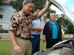 County Energy Commissioner Victor Reyes shows Mayor Tavares her new wheels.  Tavares made renewable energy one of her top issues and the test program is in line with her goals for sustainability. 
