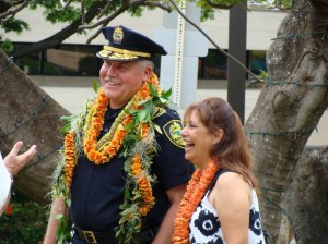 Chief Phillips accompanied by his wife Brenda at a photo unveiling and flag folding ceremony held in his honor.  Photo by Wendy OSHER.
