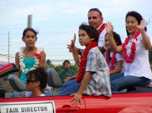 2008 Maui County Fair Director Sherri Grimes joins her family in waving to parade spectators.  File Photo by Wendy Osher.