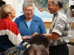 Finance Director Fred Pablo (right) joins Maui Mayor Charmaine Tavares (middle) in unveiling the FY 2010-2011 Budget in March with Councilmember Gladys Baisa (left) looking on.
