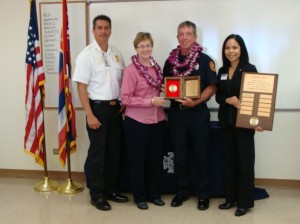 (Photo from left to right: Maui Fire Chief Jeffrey Murray, County Managing Director Sheri Morrison, Firefighter I Lawrence "Larry" Crilley, and Leilani Johnson of Liberty Mutual.  Photo by Wendy Osher)