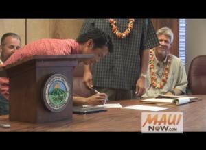 Mark Okano of Aiea became the first to sign on as a player on the new Na Koa Ikaika Maui roster during a press conference on Tuesday in Wailuku.  Photo by Wendy Osher.