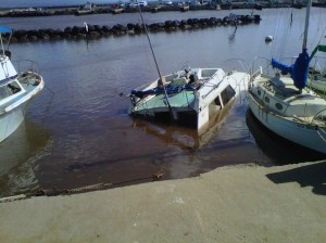 One of several boats that sank at Māʻalaea Harbor following one of the tsunami surges, resulting from the March 11, 2011 Japan earthquake. File photo by Sonia Isotov.