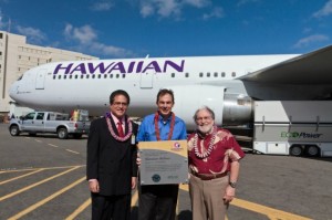 State Senator J. Kalani English (left) and Governor Neil Abercrombie (right), present a plaque to Mark Dunkerley, Hawaiian’s president and CEO. Courtesy of Hawaiian Airlines.