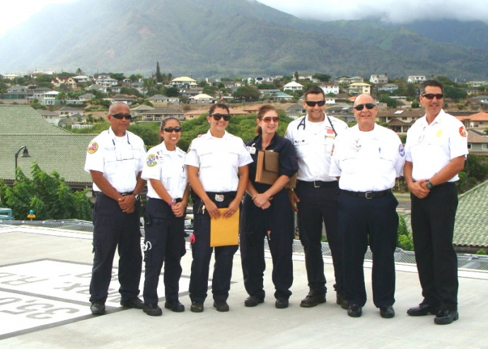 Medics and emergency responders pose for a picture during the dedication in September of 2011, of the helipad at the Maui Memorial Medical Center.  The helipad is used in the transport of patients via Medevac for emergency medical care. File photo by Wendy Osher.