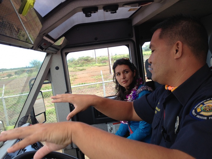 Rep. Tulsi Gabbard takes a tour of the Kahului Airport runway with members of the Kahului Airport Fire Rescue and receives a firetruck demonstration.  Courtesy photo.
