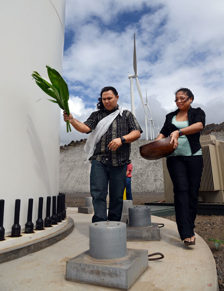 Kahu Dane Maxwell, with the assistance of his wife, Jennifer, led a Hawaiian blessing for each of the eight turbines on the Auwahi Wind Farm Friday during the official facility dedication in Ulupalakua.