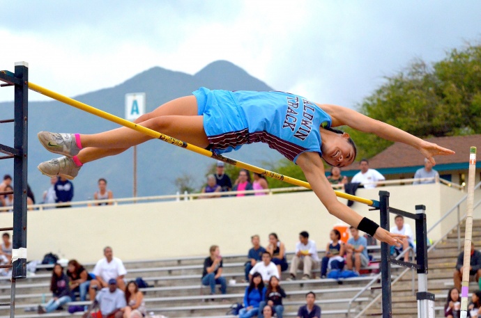 Baldwin's Amber Kozaki clears the pole vault bar at 12 feet, 1 inch, breaking her own meet record of 12-0 at Friday's Yamamoto Invitational track meet. Photo by Rodney S. Yap.