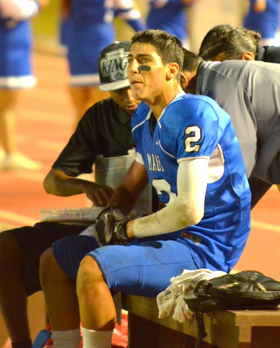 Maui High's Andre Pierman makes a rare sideline appearance Saturday for equipment  issues. Photo by Rodney S. Yap.