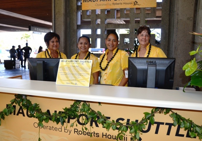 Maui Airport Shuttle employees (from left): Karen Fujimoto, Mary Ann Tamashiro, Cypress Kamaunu, and Carol West were among the Roberts Hawaiʻi employees working the first day of service on Aug. 1, 2013. 