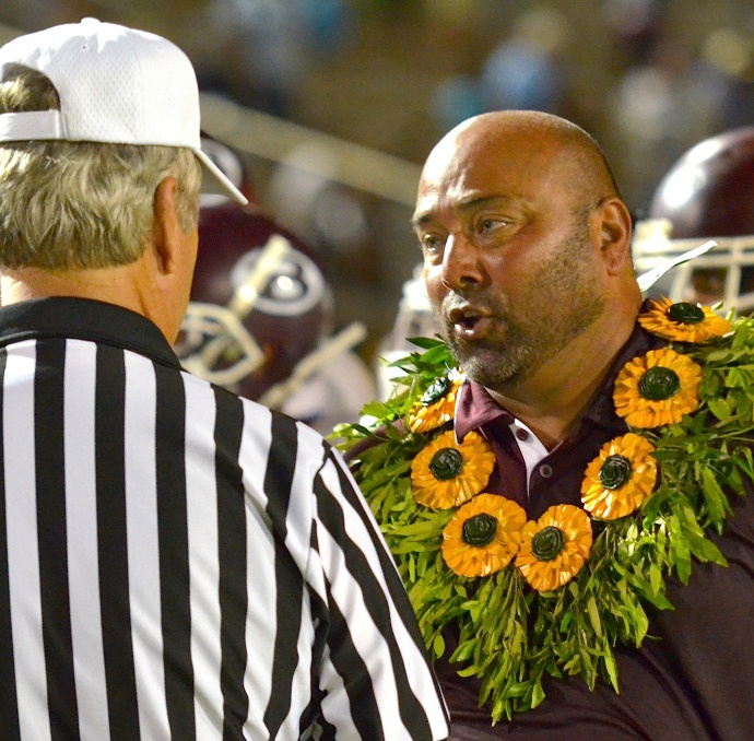 Baldwin head coach Keneke Pacheco earned his first MIL win and the game ball Friday after Baldwin defeated Maui High, 33-13. Photo by Rodney S. Yap.