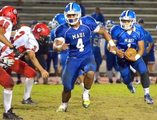 Maui High's Soane Vaohea (1) follows the lead block of Onosai Emelio (4) during second-half action Friday at War Memorial Stadium. Photo by Rodney S. Yap.