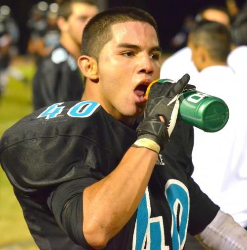 King Kekaulike's Christian Garcia Alvarez enjoys a much deserved water break following his 62-yard fumble return for touchdown in the fourth quarter. Photo by Rodney S. Yap.