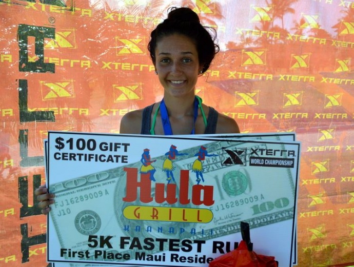 Dakota Grossman holds up her gift certificate for winning the women's 5K. Photo courtesy of XTERRA photos.